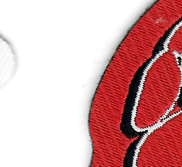 Laser-cut edge on a woven patch